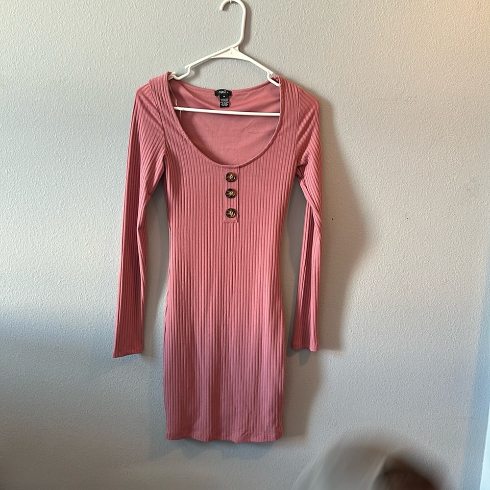 A long sleeve,mid thigh pink dress.